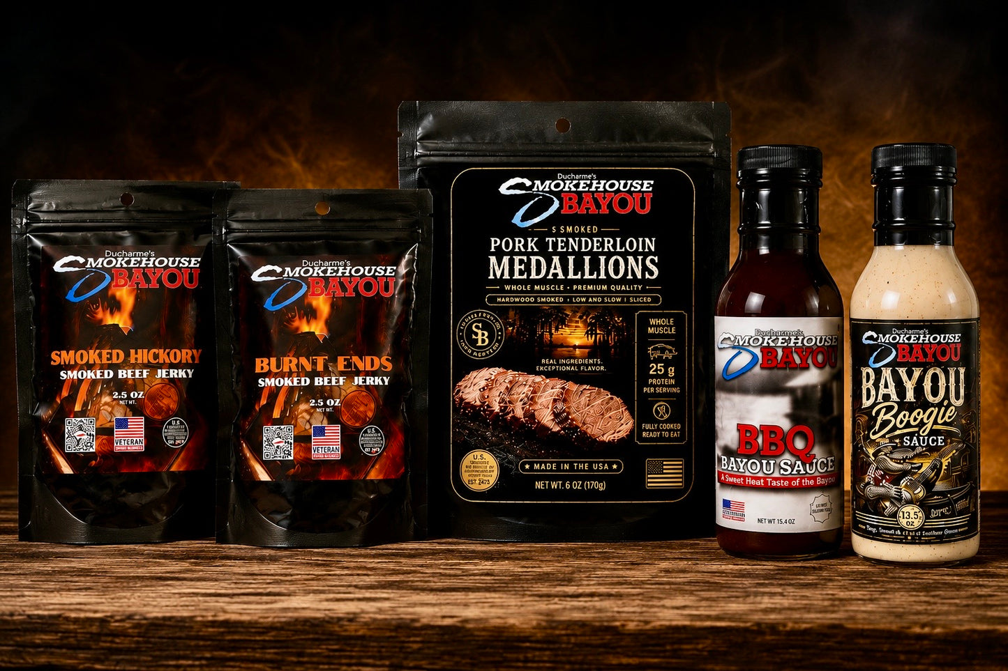 Smokehouse Bayou smoked meats collection with Burnt Ends beef jerky, 6 oz Smoked Pork Tenderloin Medallions, Bayou BBQ Sauce, and Bayou Boogie Sauce.