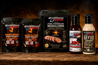 Smokehouse Bayou smoked meats collection with Burnt Ends beef jerky, 6 oz Smoked Pork Tenderloin Medallions, Bayou BBQ Sauce, and Bayou Boogie Sauce.