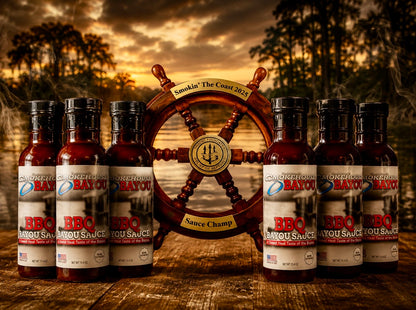 Bottles of BBQ sauce with a wooden wheel trophy in the background. 