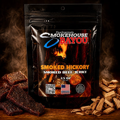 Smokehouse Bayou Smoked Hickory beef jerky package with jerky pieces and hickory wood chips on rustic wood